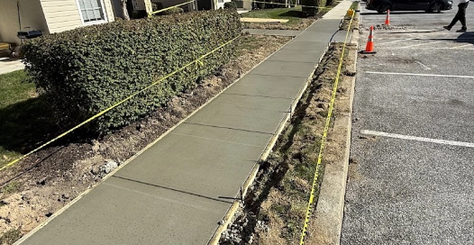 A photo of a recently poured concrete sidewalk that is made to ADA standards by RJL Concrete Service in Central PA
